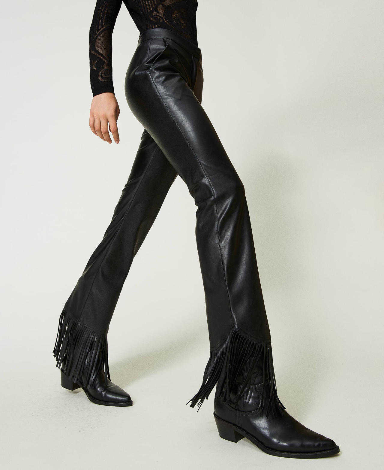 Leather-like trousers with fringes