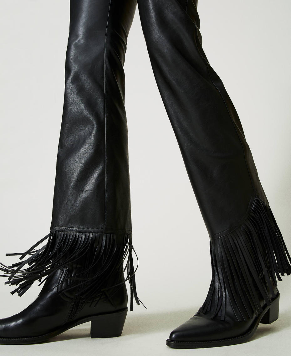 Leather-like trousers with fringes