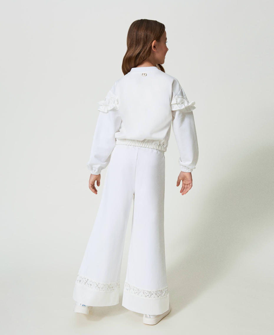 Disclaimer pantaloni palazzo bambina con logo strass ecrù