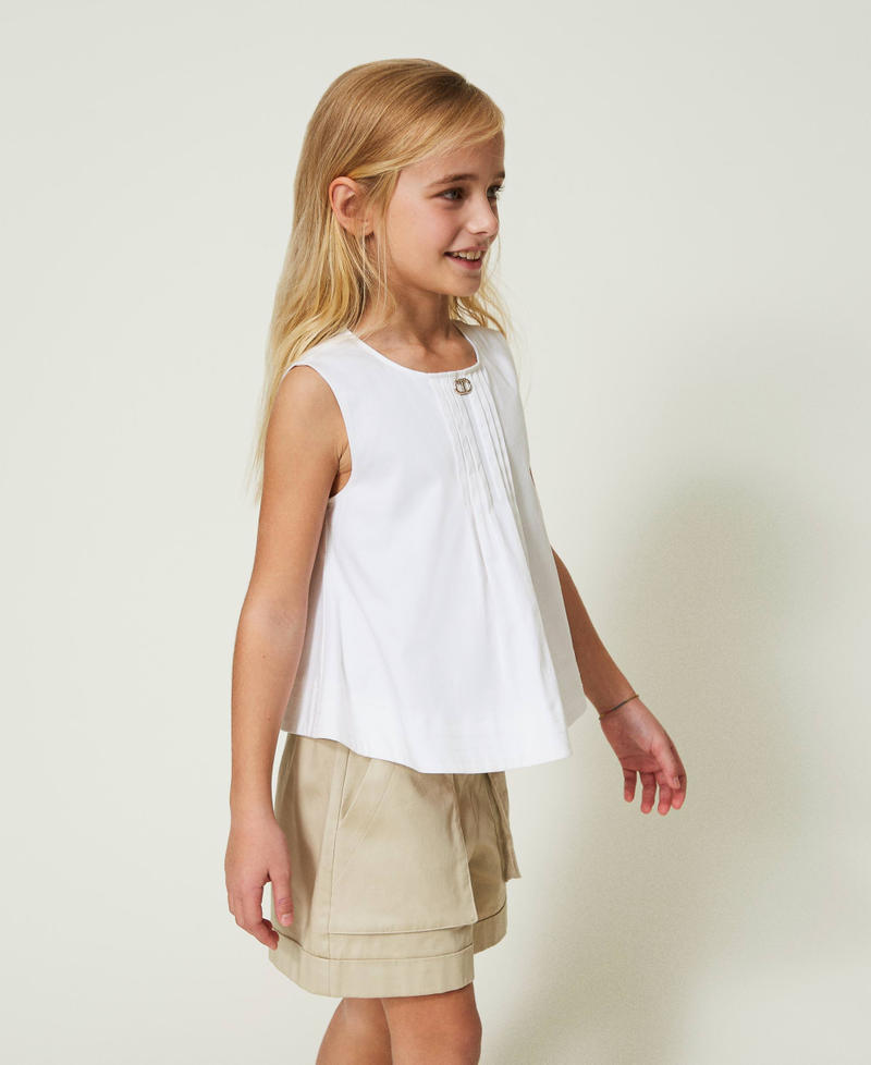 Top with front pleats