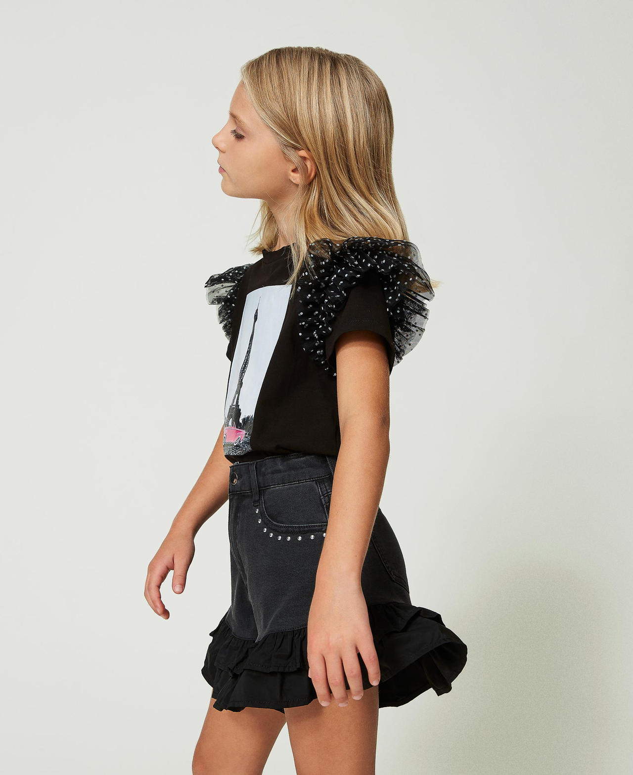 Shorts in jeans nero con volant