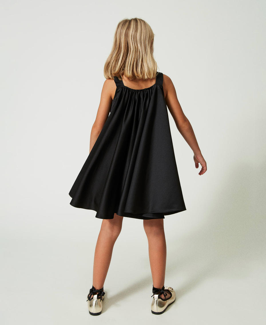 Short satin dress with bow