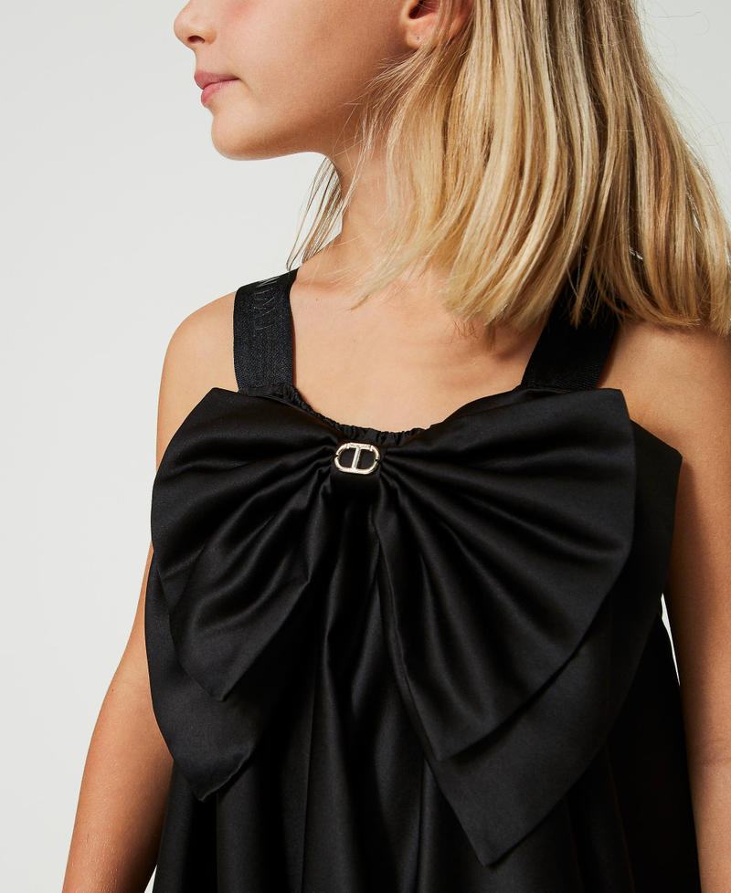 Short satin dress with bow