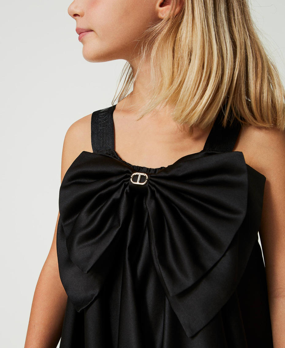 Short satin dress with bow