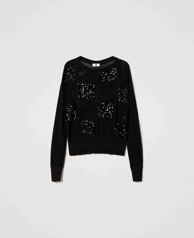 Pull en point résille et sequins