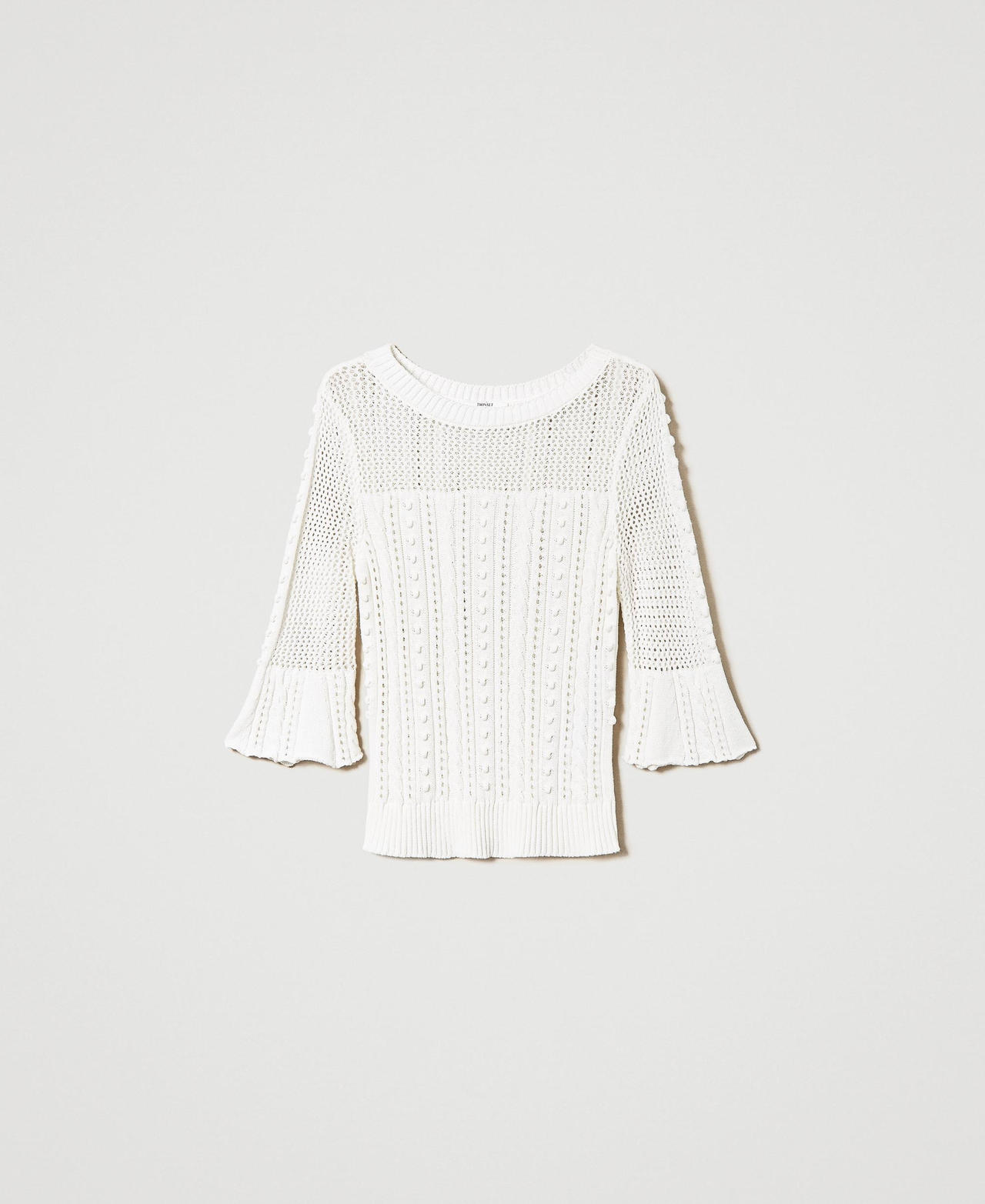 Pull avec mélange de points et de torsades