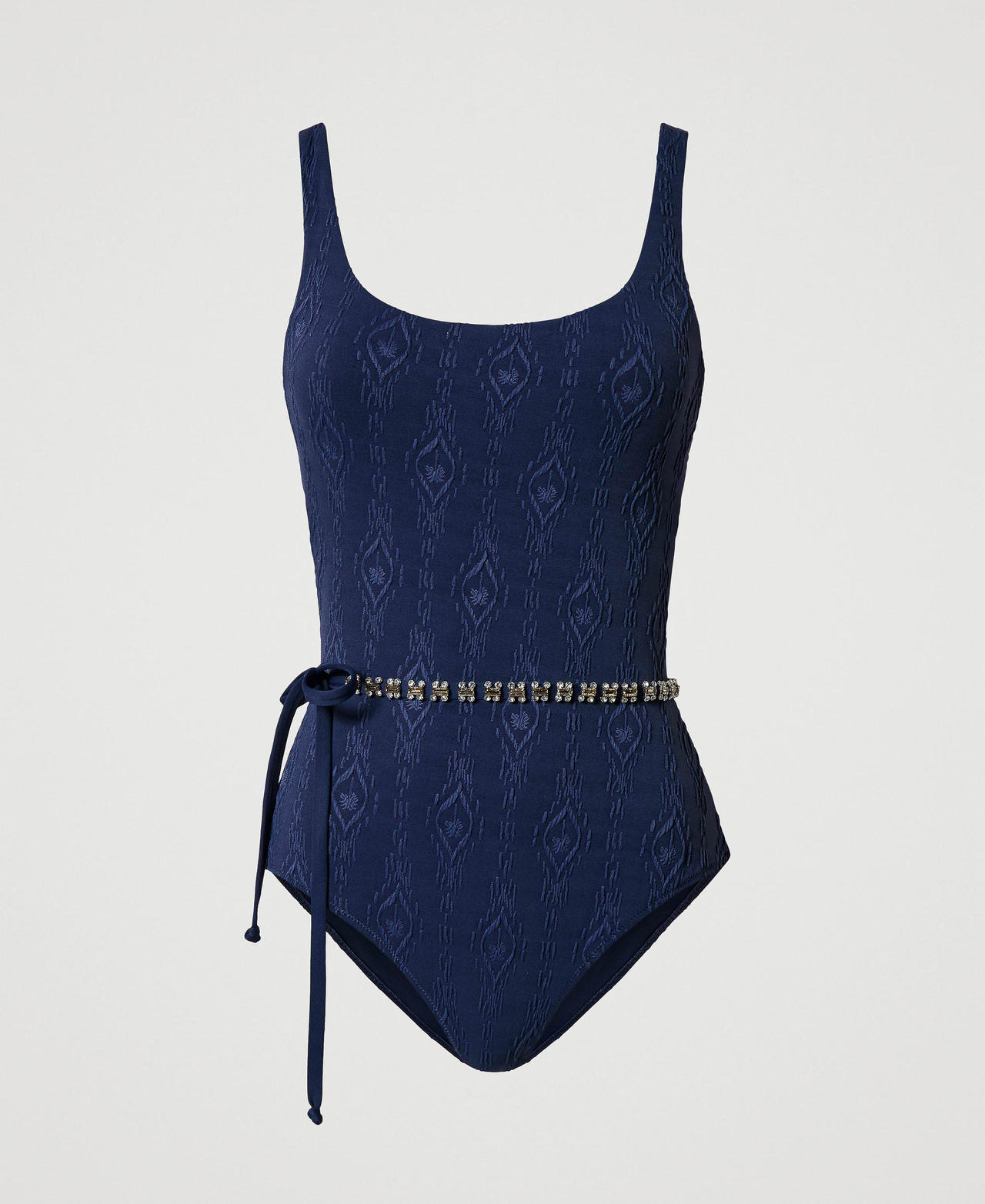 One-piece swimsuit with embossed design and belt