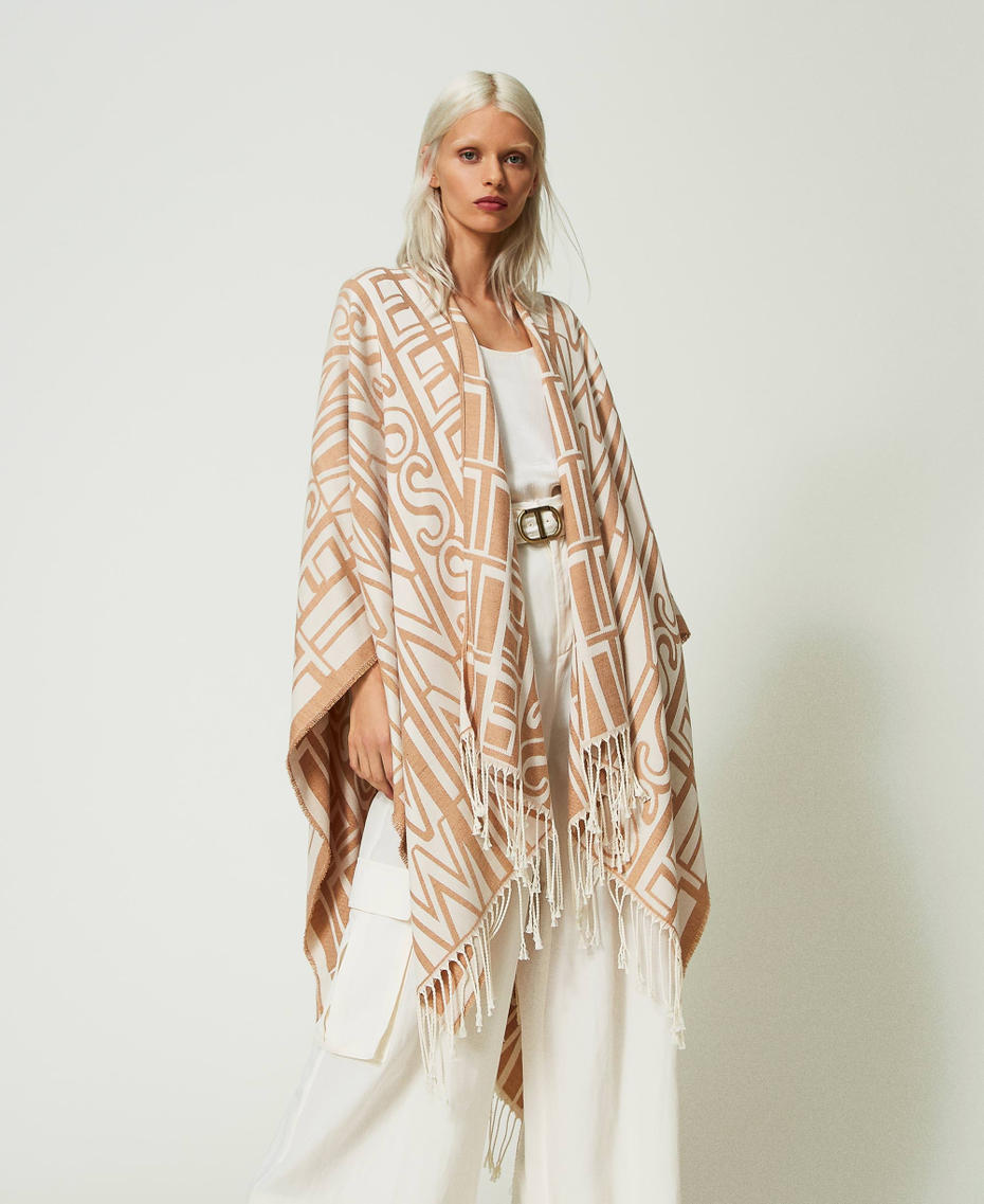 Jacquard poncho with logo and fringes