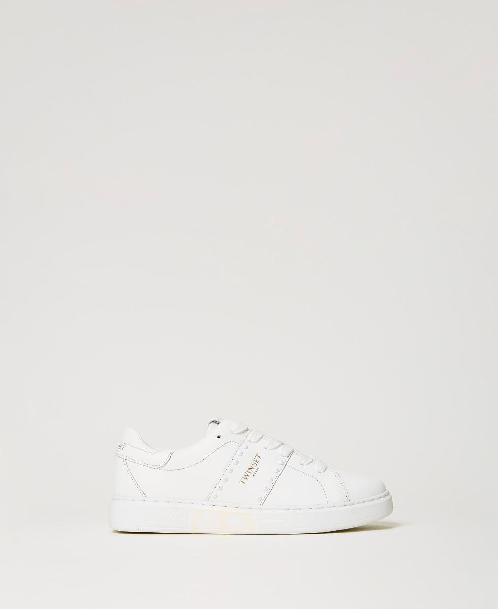 Sneakers de piel con tachuelas Blanco Mujer 241TCP014_00001_01