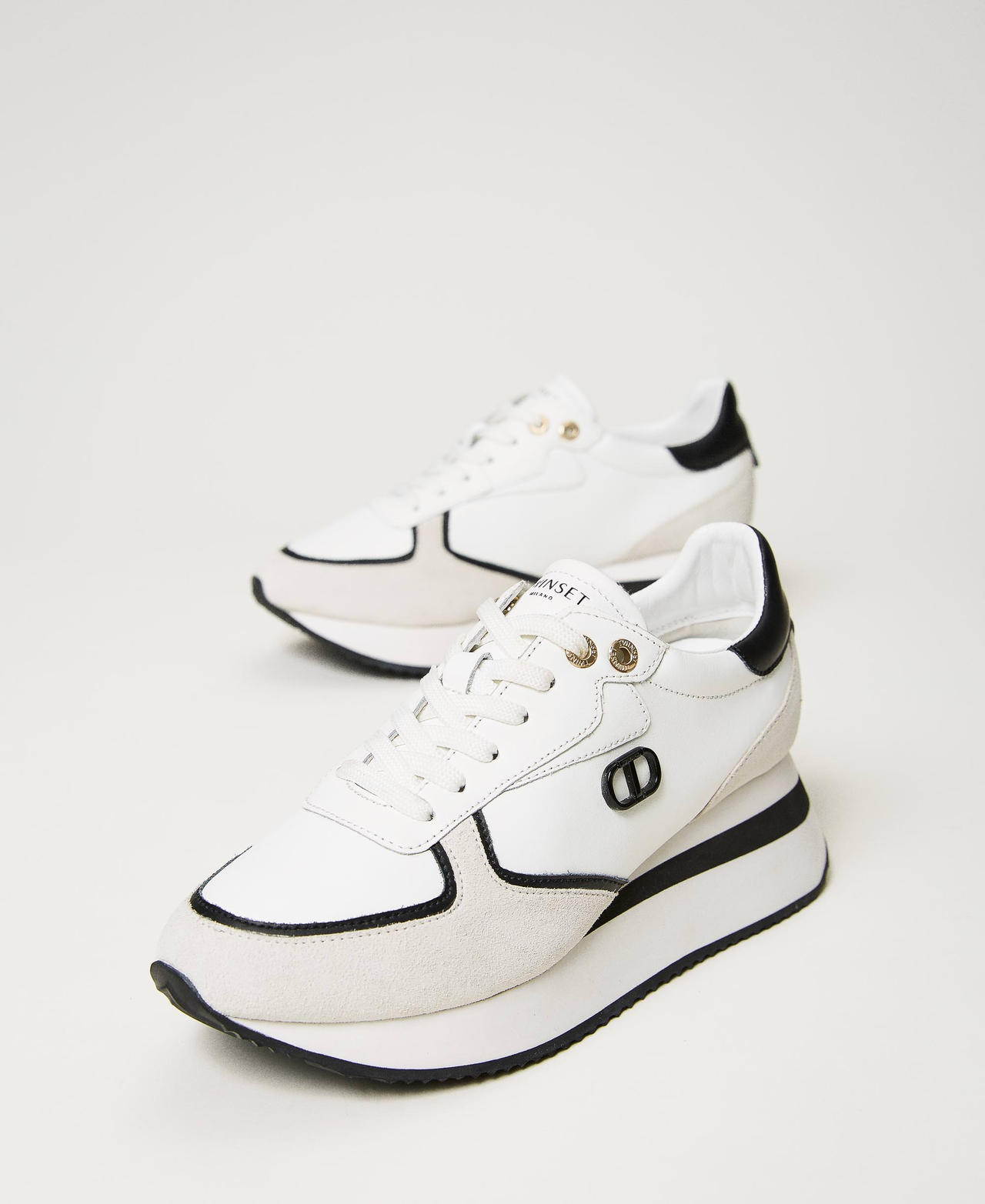 Wedge-Sneaker aus Leder Zweifarbig Optisches Weiß / Schwarz Frau 241TCP080-02