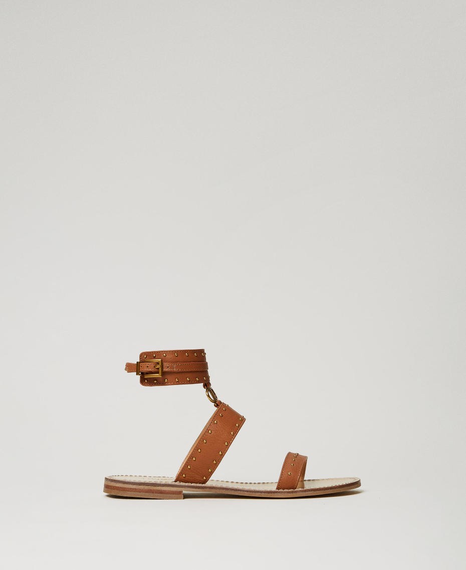 Flat leather sandals with studs