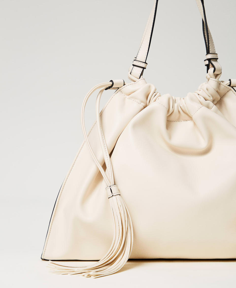 Hobo bag with Oval T and drawstring with tassels