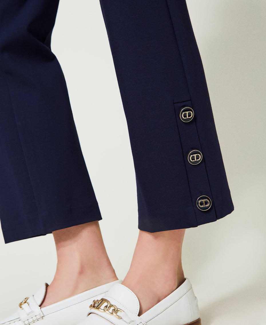 Cropped trousers with Oval T buttons