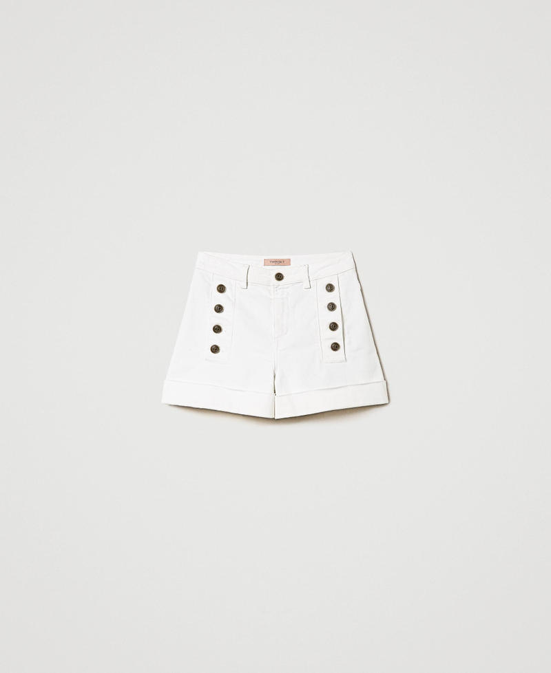White denim shorts with decorative buttons