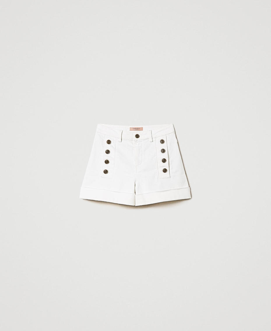 White denim shorts with decorative buttons