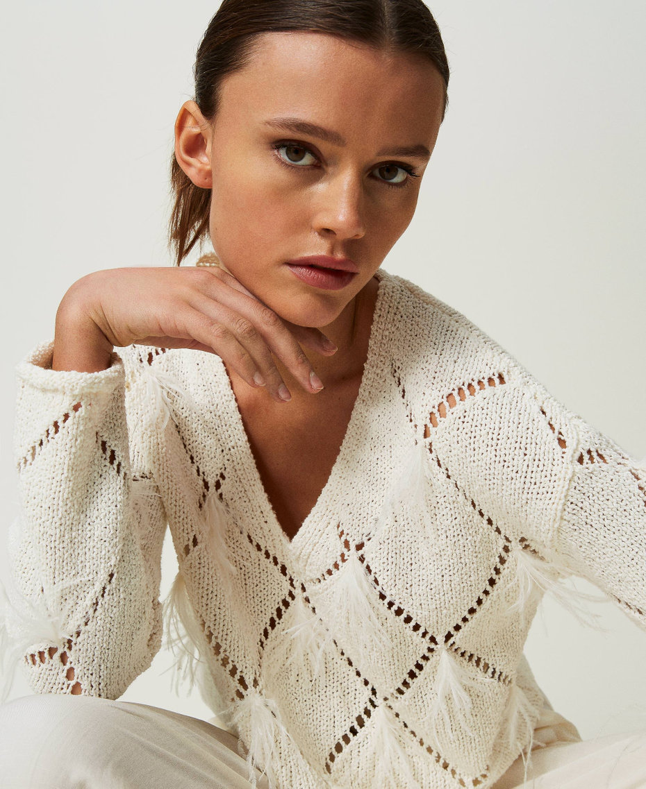 Pull à losanges avec plumes