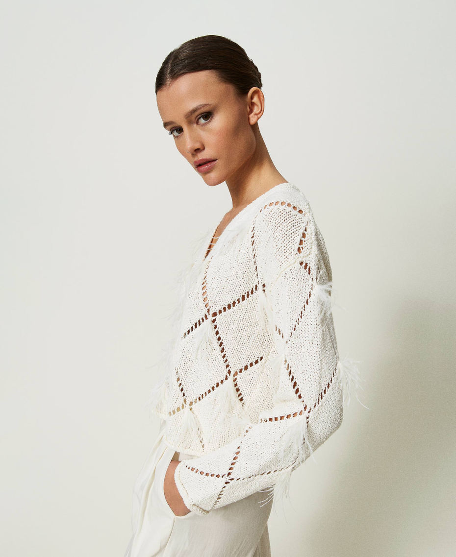 Pull à losanges avec plumes