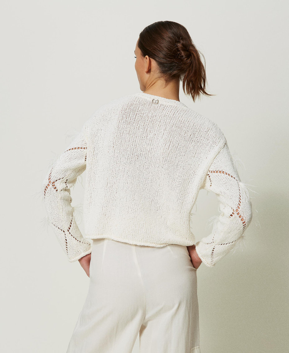 Pull à losanges avec plumes