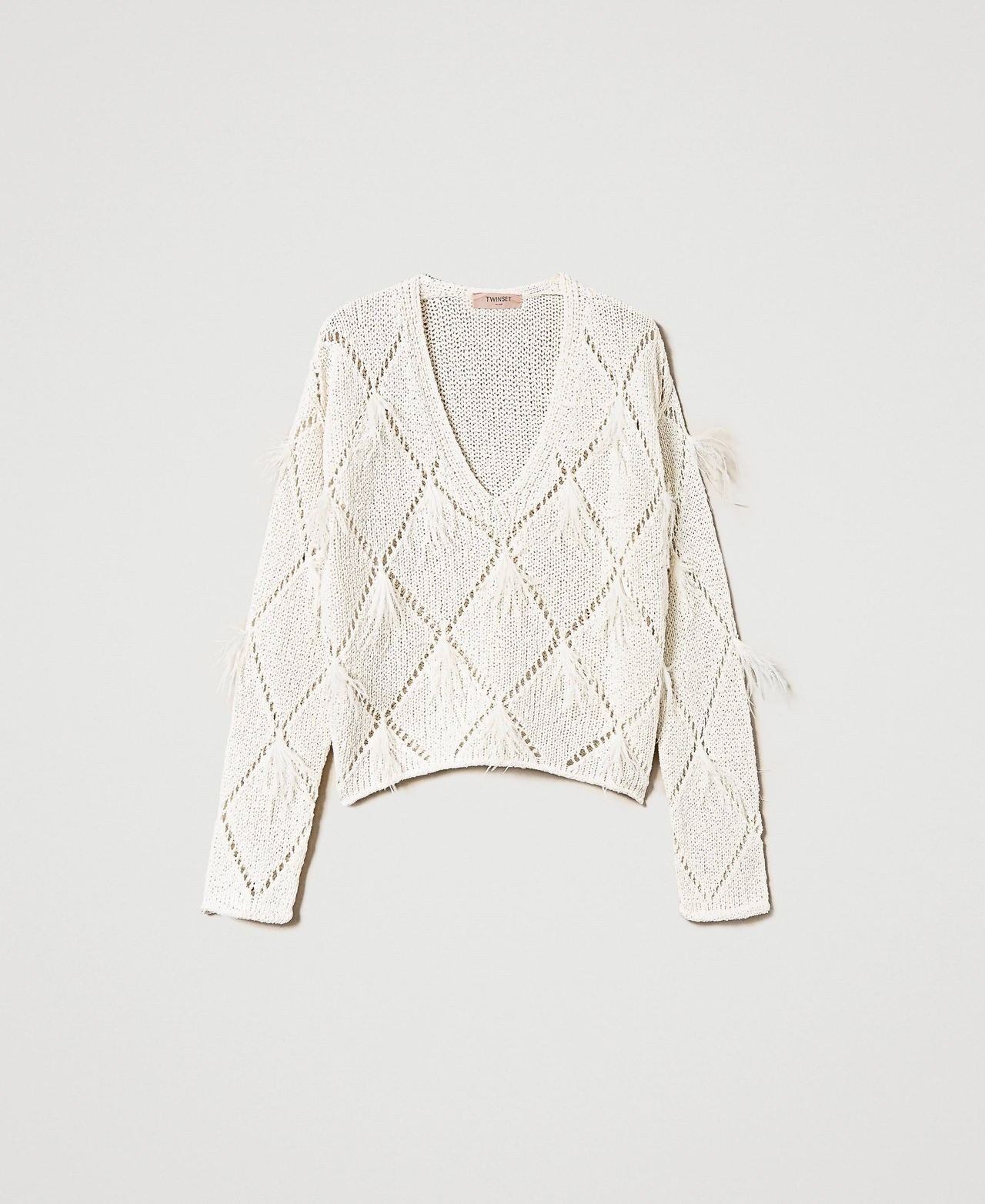 Pull à losanges avec plumes