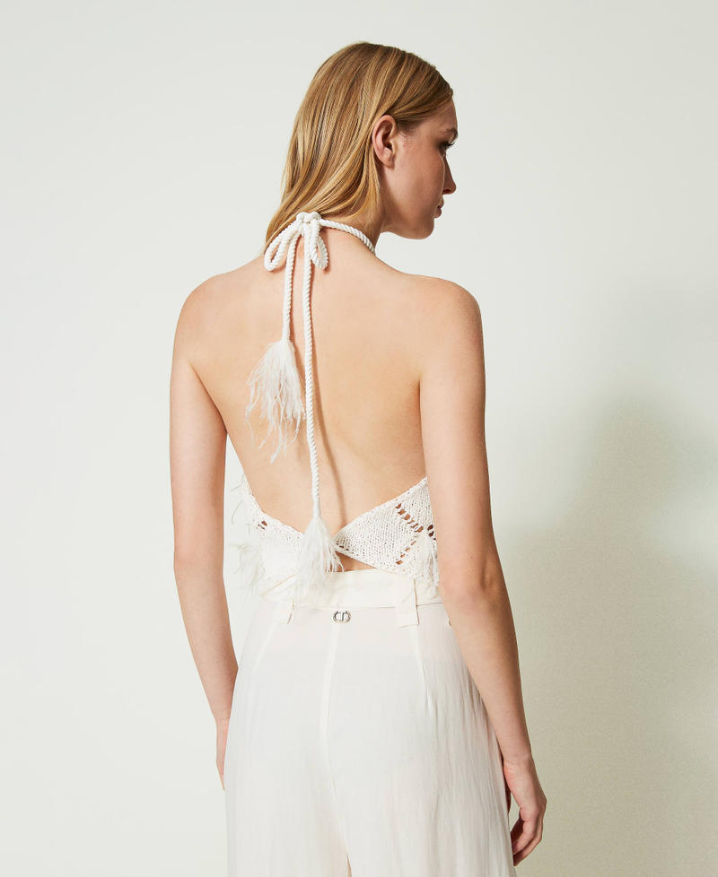 Diamond-pattern top with feathers