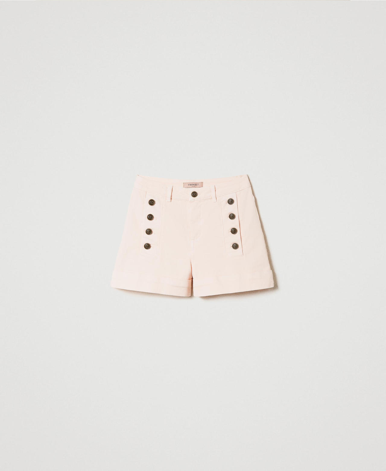 Drill shorts with decorative buttons