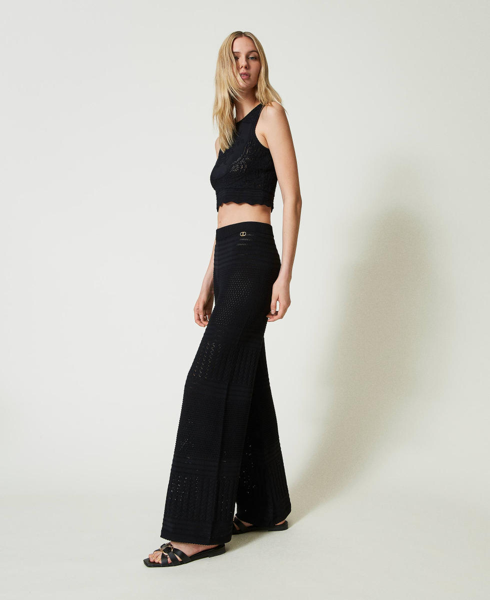 Crochet-like knit trousers