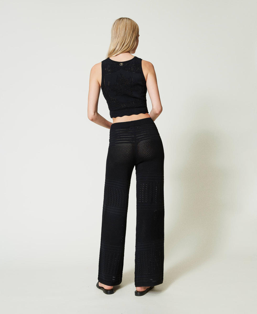Crochet-like knit trousers