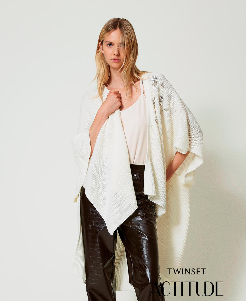 Knit poncho with embroidery