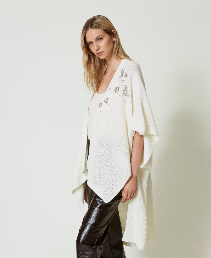 Knit poncho with embroidery