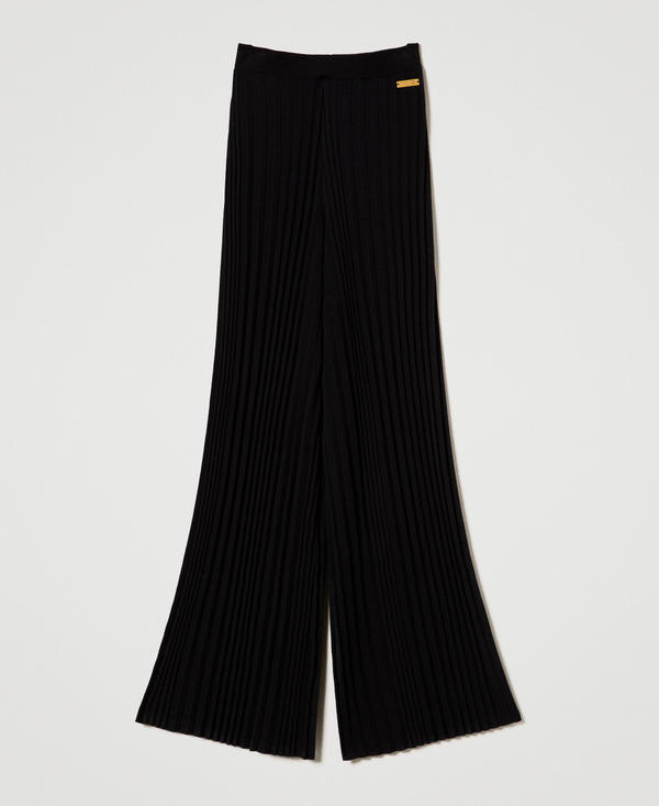 Pantaloni in maglia pliss&eacute;