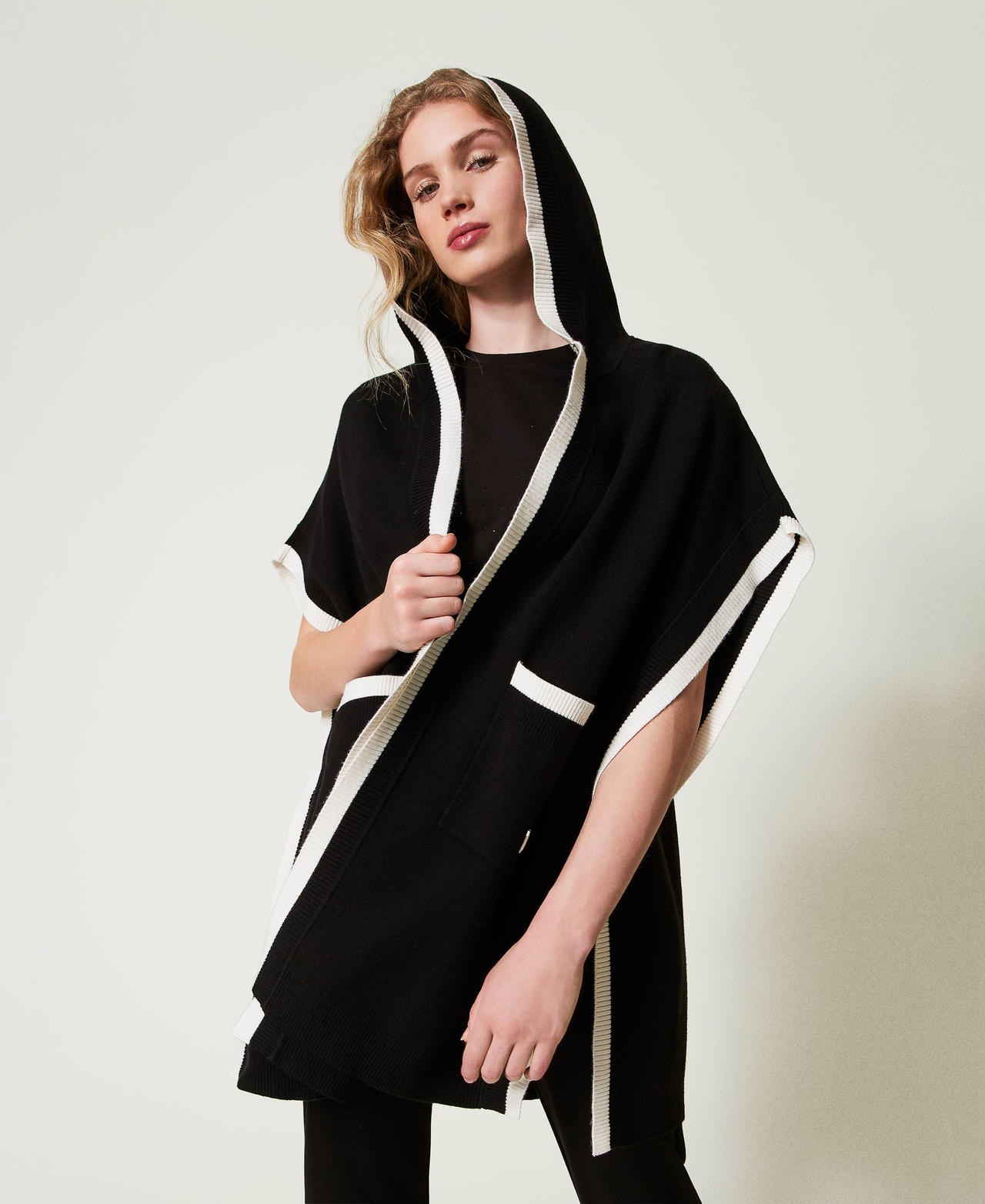 Knit poncho with pockets