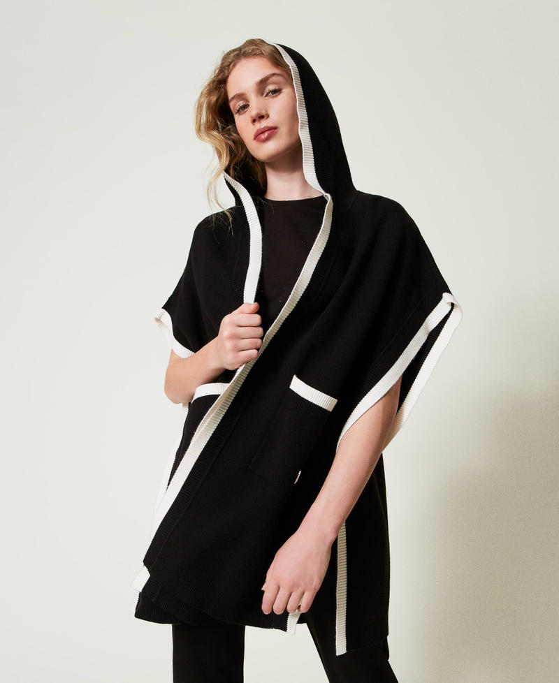 Knit poncho with pockets