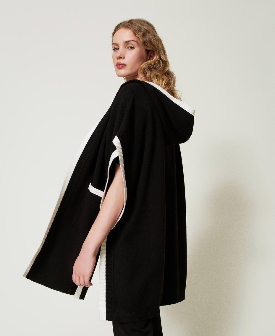 Knit poncho with pockets