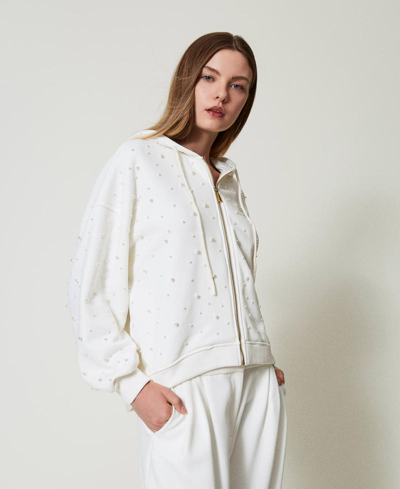 Asymmetric hoodie with pearls