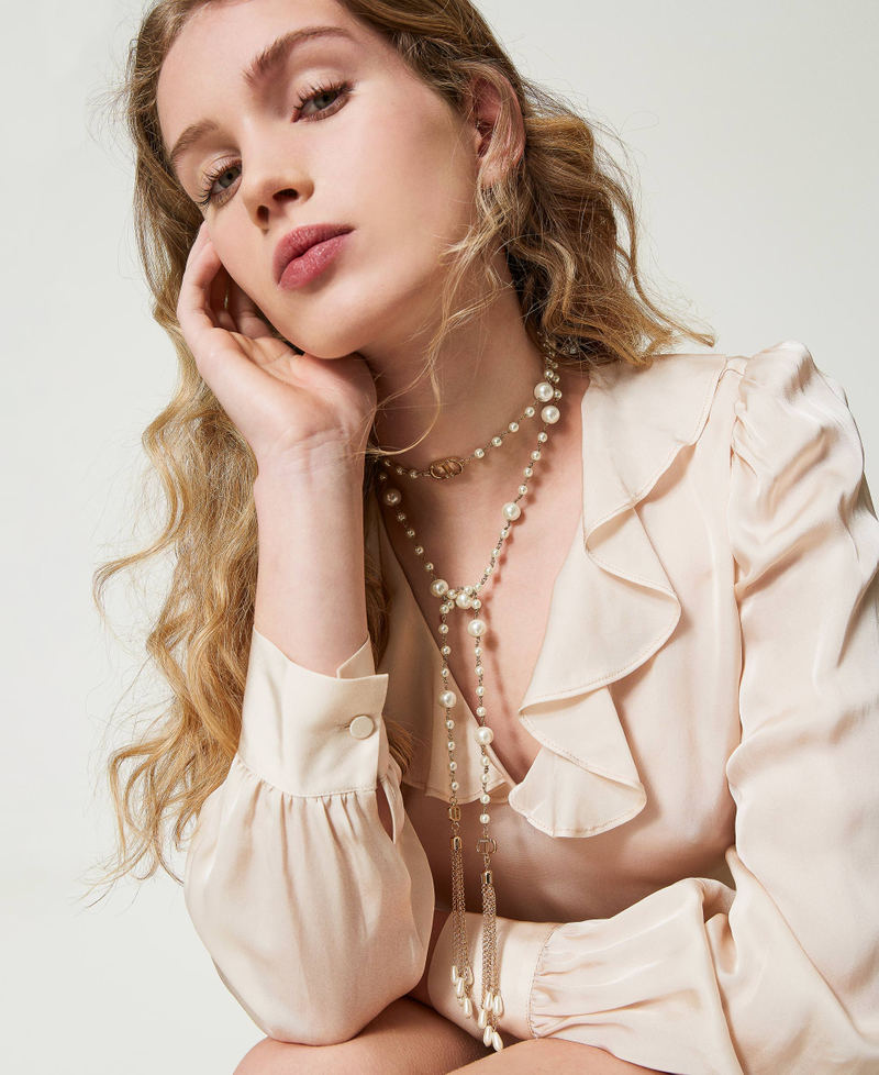 Collier réglable avec pompons pendants