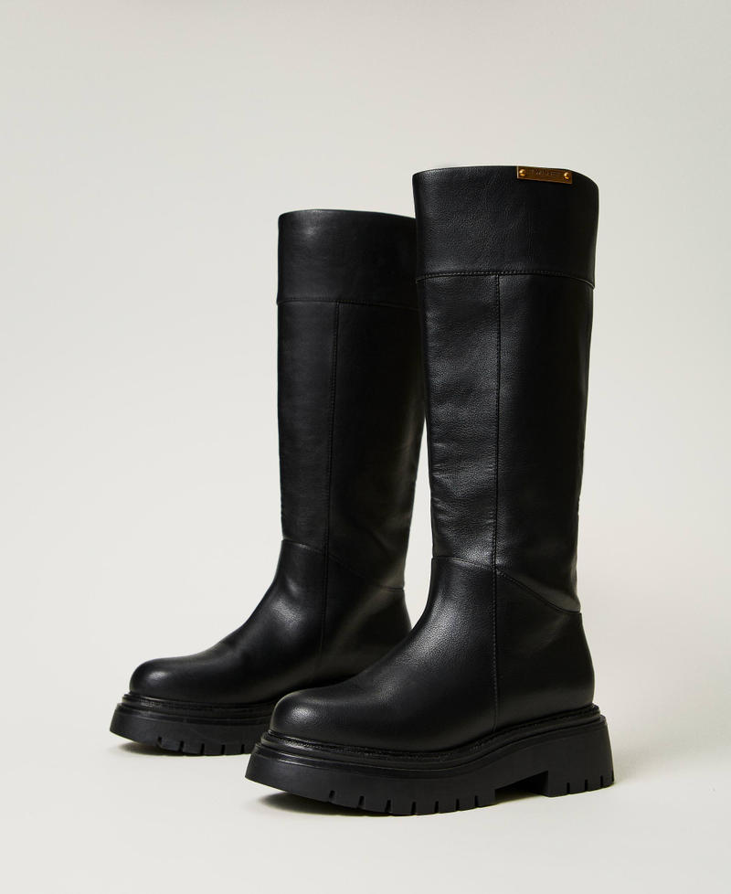 High boots with logo plate