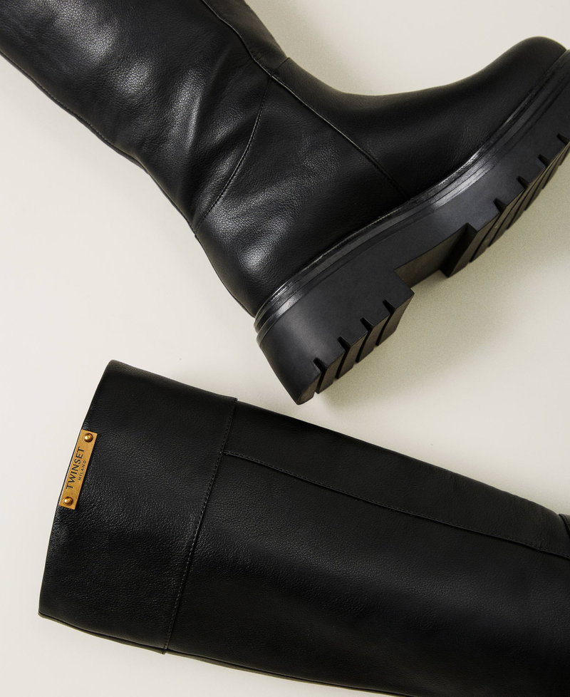 High boots with logo plate