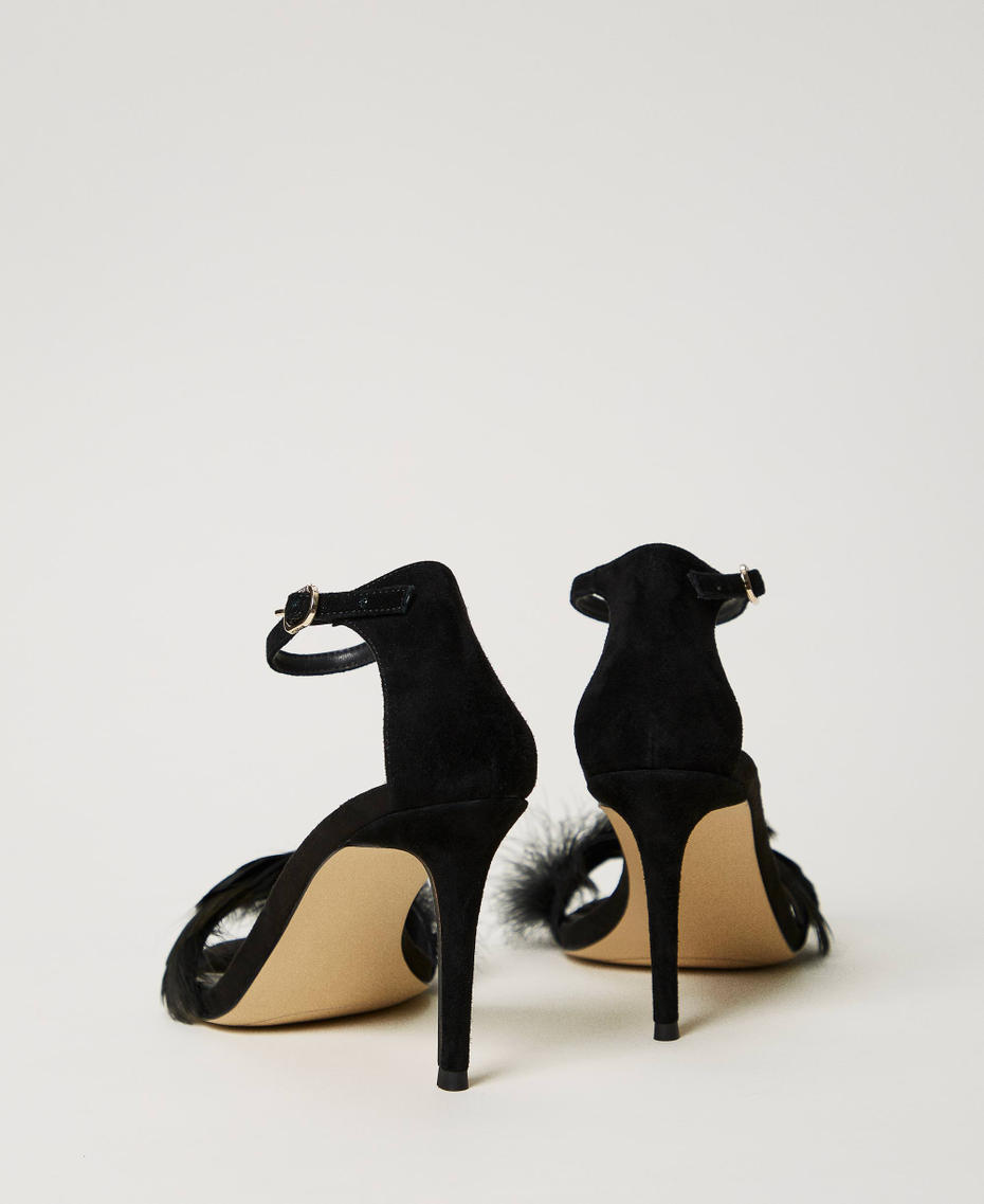 Leather sandals with feathers