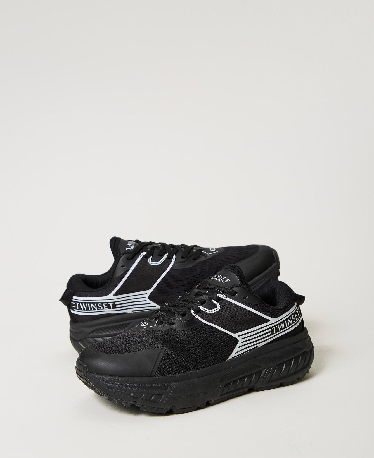 Striped Fessura trainers with contrasting logo Black Woman 242TCP214_00006_02