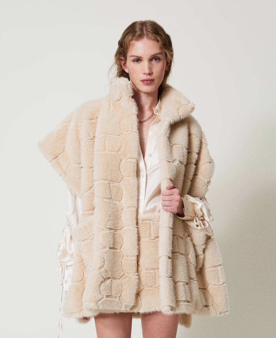 Faux fur poncho with logo