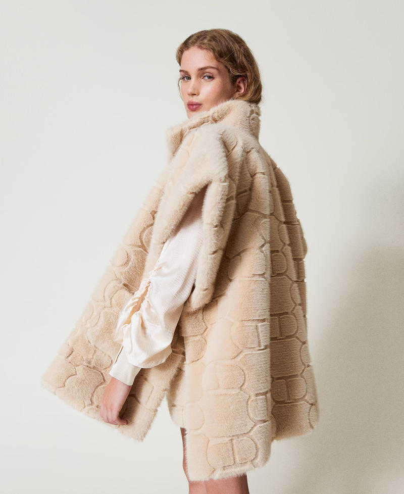 Faux fur poncho with logo