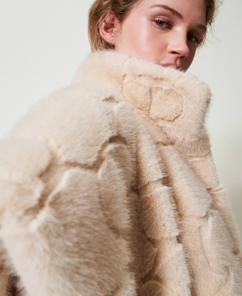 Faux fur poncho with logo