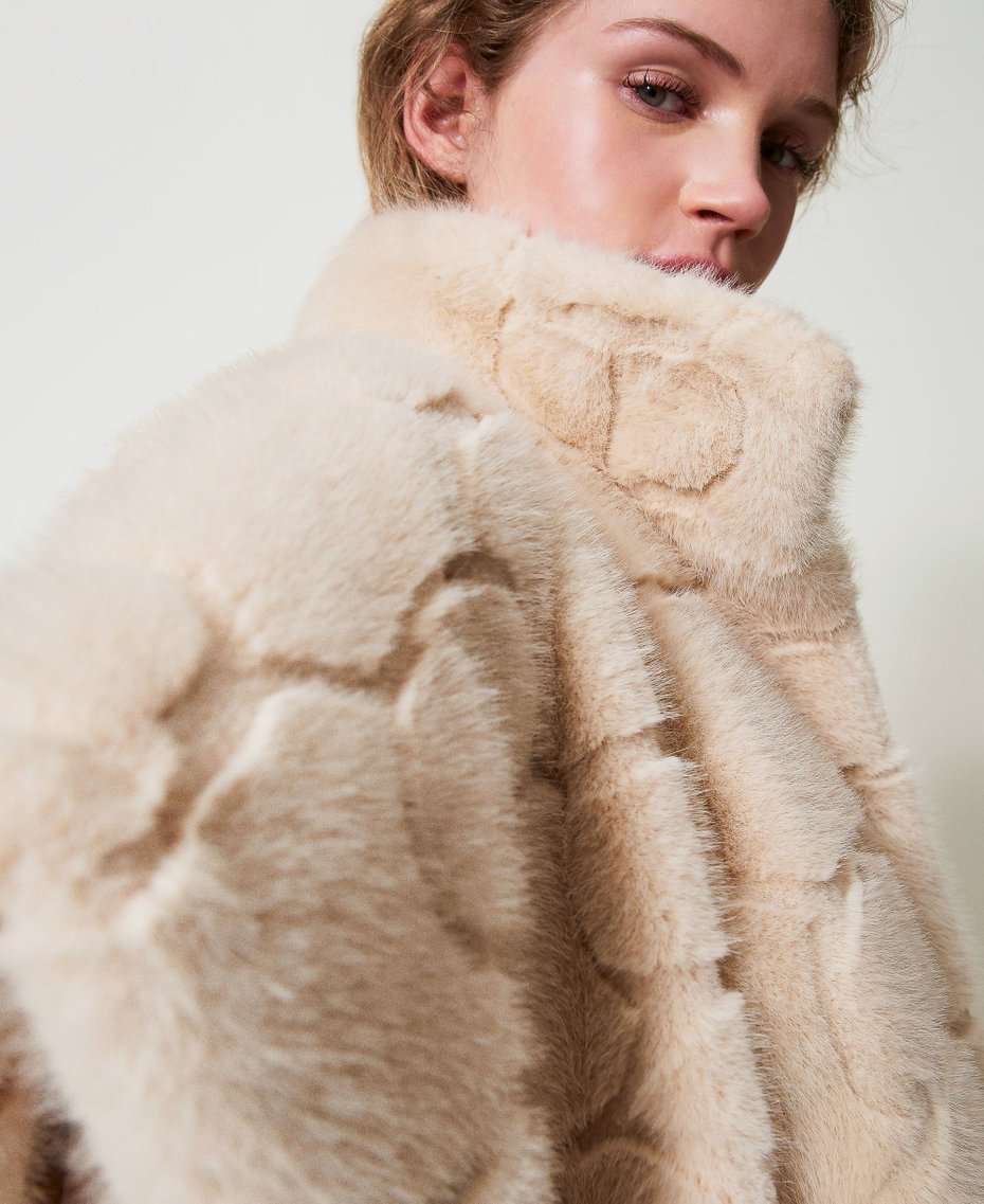 Faux fur poncho with logo