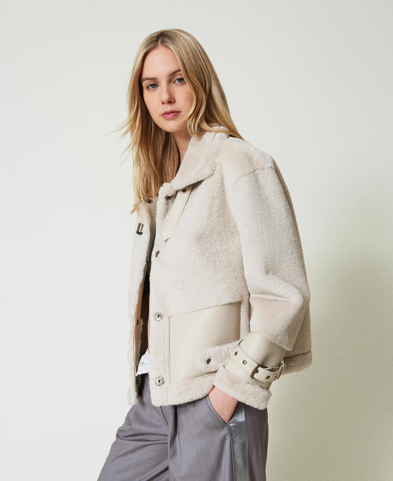Faux fur jacket with straps