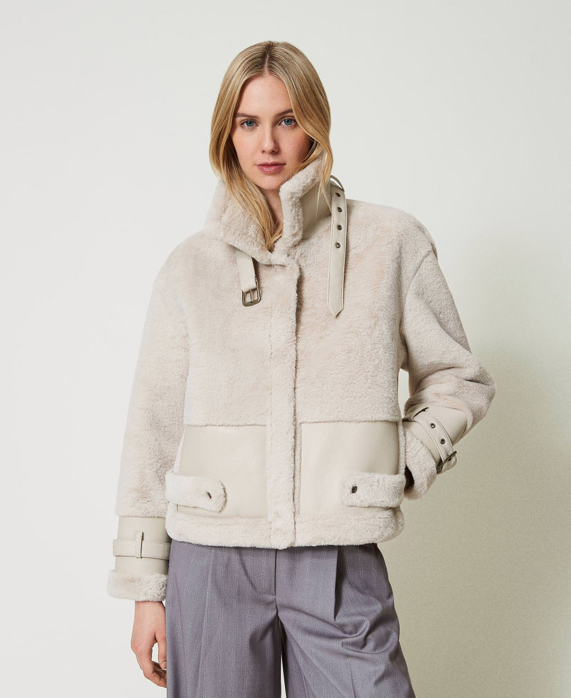 Faux fur jacket with straps