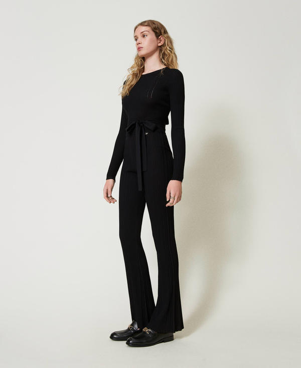 Pantaloni flare in maglia a costine