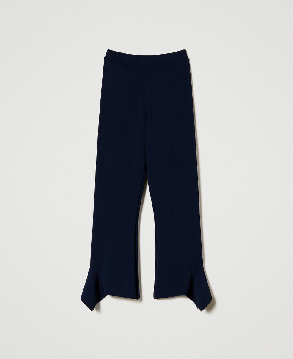 Flared knit trousers with ruffles