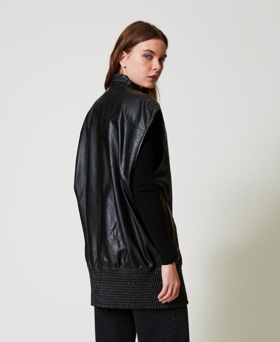 Long faux leather sleeveless jacket