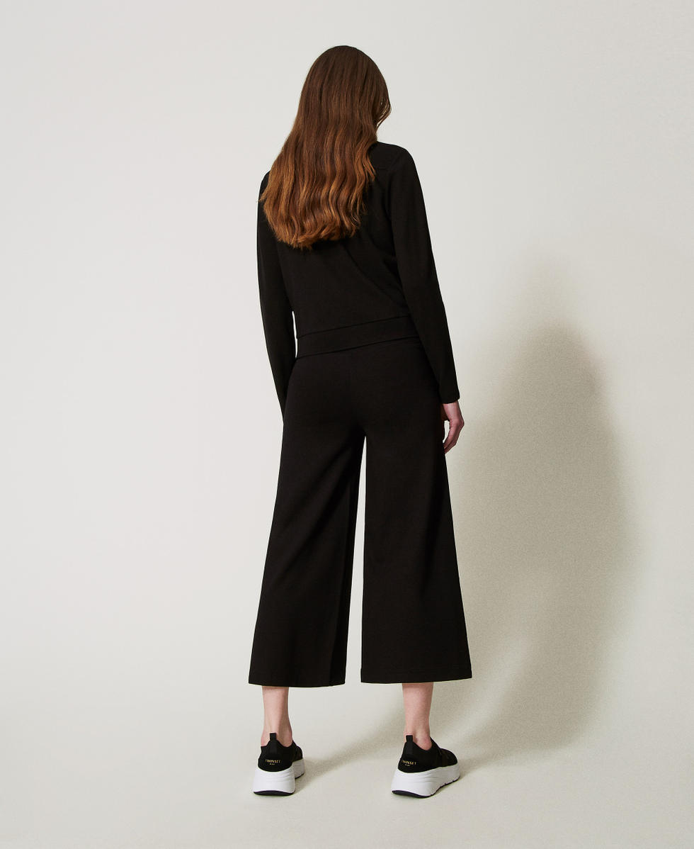 Cropped-Hose mit Schlitzen Schwarz Frau 251LL2RDD_00006_03