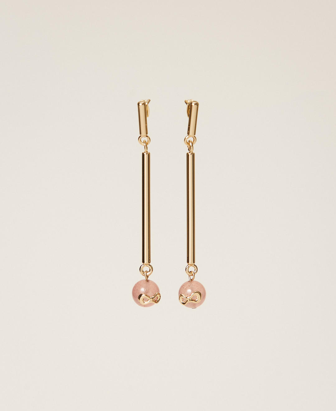 Boucles d'oreilles avec pierres et logo